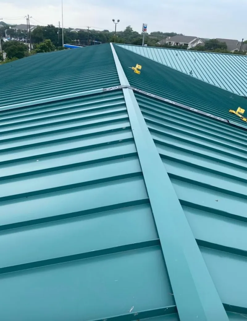 Green commercial metal roof ridge and valley for Metal Roof Repair in Brick